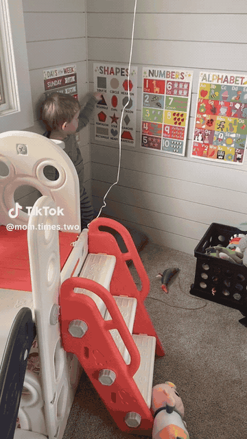 A toddler at the poster wall, from a real customer review